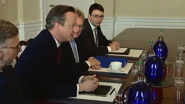 David Cameron and aides