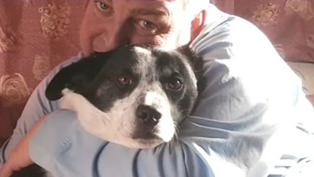 Garry Betts with his dog, Buster