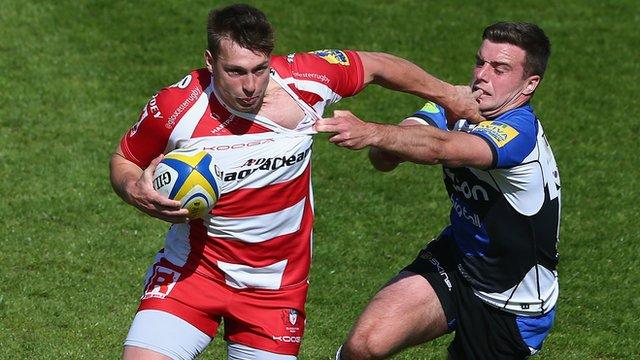 Bath's George Ford (right) challenges Brendan Macken of Gloucester