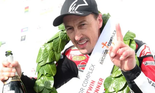 I'm number one - Jeremy McWilliams celebrates his victory in Saturday's Supertwins race