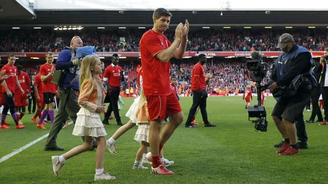 Steven Gerrard applauds the Kop