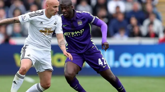 Jonjo Shelvey and Yaya Toure battle for the ball