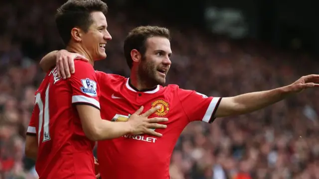 Herrera and Mata celebrate