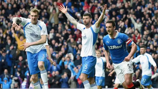 Kevin Holt and Andy Durnan appeal to the assistant referee as Lee Wallace runs away to celebrate his goal