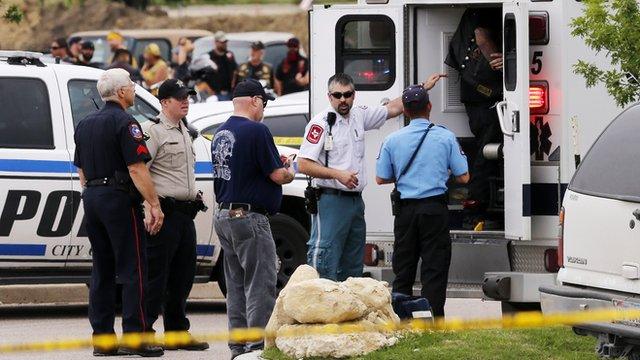 Emergency responders tend to a wounded person near a Twin Peaks restaurant