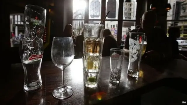 Empty drinks glasses on a bar