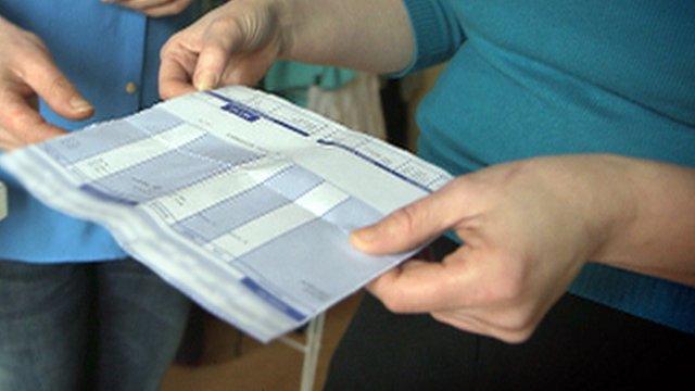 Worker looking at payslip