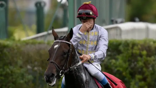 Treve and jockey Thierry Jarnet after winning the 2014 Arc