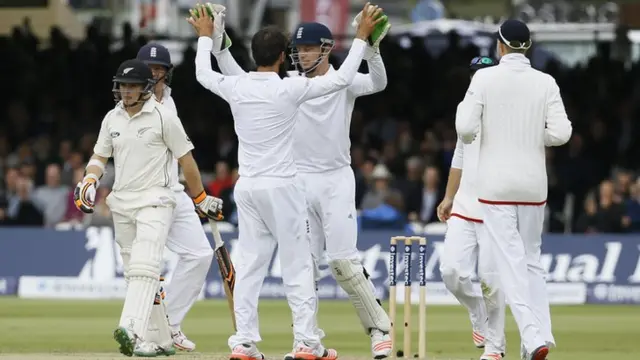 England celebrate taking the wicket of Tom Latham