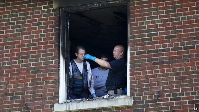 Investigators inside the house