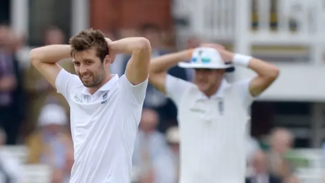 Mark Wood and Stuart Broad react to a missed chance