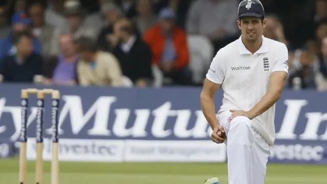 Alastair Cook polishes the ball