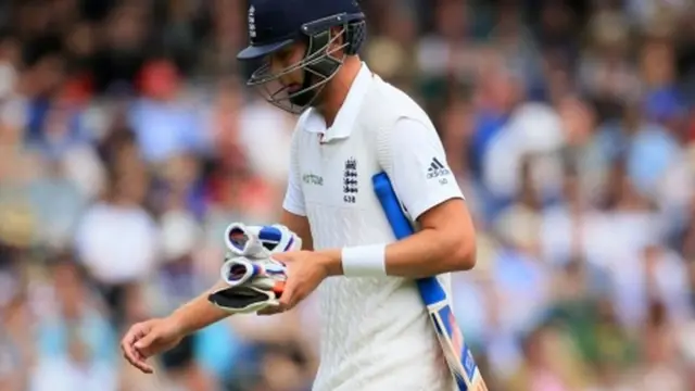 Stuart Broad walks after being bowled out