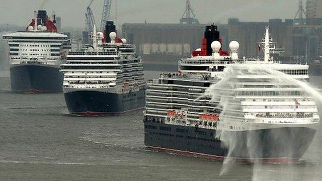 The ocean liners Queen Mary Two, Queen Victoria and Queen Elizabeth meet on the River Mersey