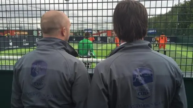 Two men in Peoples Cup jackets