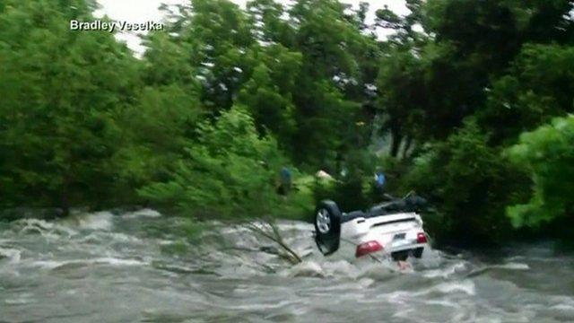 Car floating in river