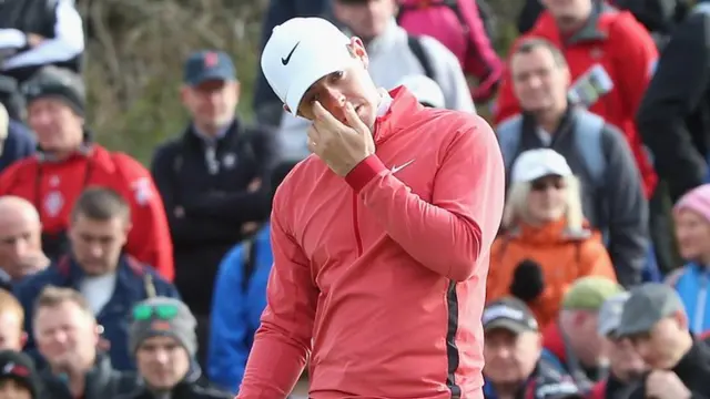 Rory McIlroy reacts to a missed putt