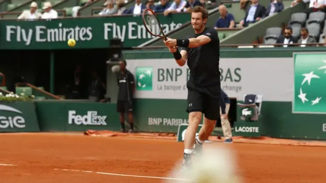 Andy Murray warms up