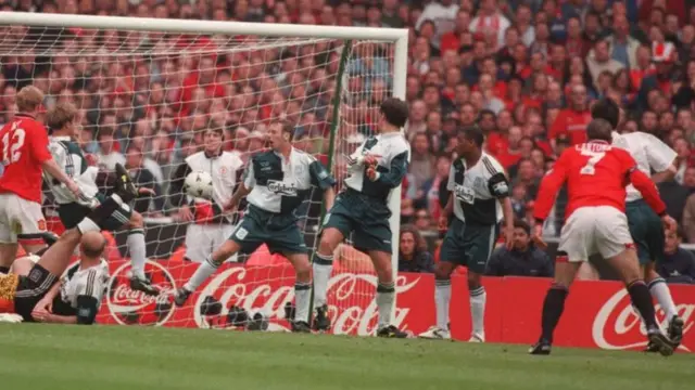 Eric Cantona (right) scores in the FA Cup final against Liverpool in 1996