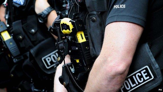 British police officer armed with a Taser