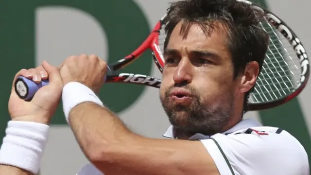 Jeremy Chardy hits a backhand shot