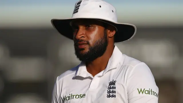 Adil Rashid looks on