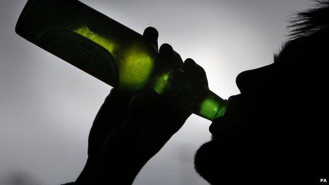 Man drinking alcohol from bottle