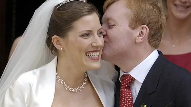 Charles Kennedy kissing his bride Sarah Gurling