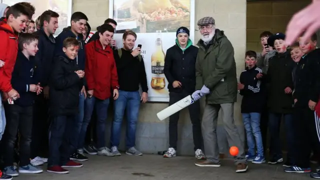 Fans play cricket