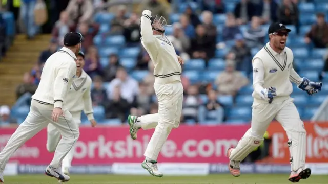 Tom Latham celebrates catching Joe Root