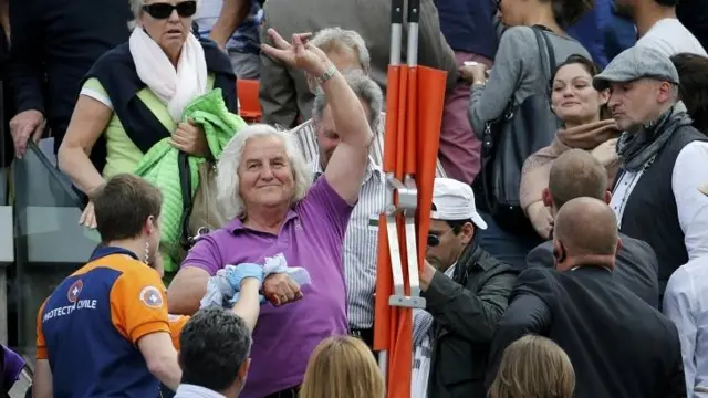 A spectator receives medical assistance