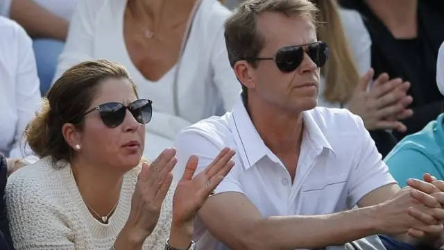 Mirka Federer, left, and coach Stefan Edberg, watch Roger Federer