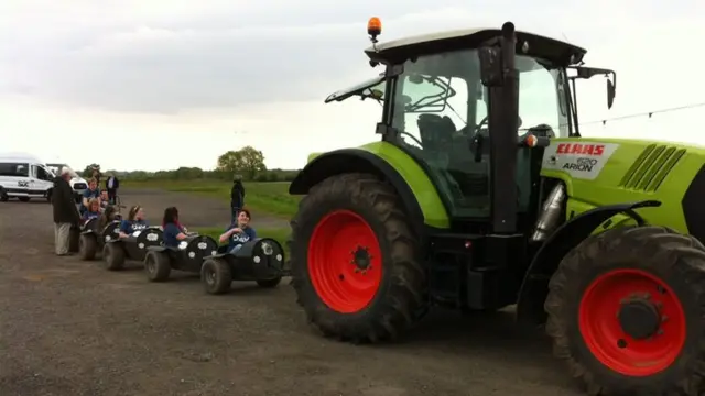 Students being pulled by tractor