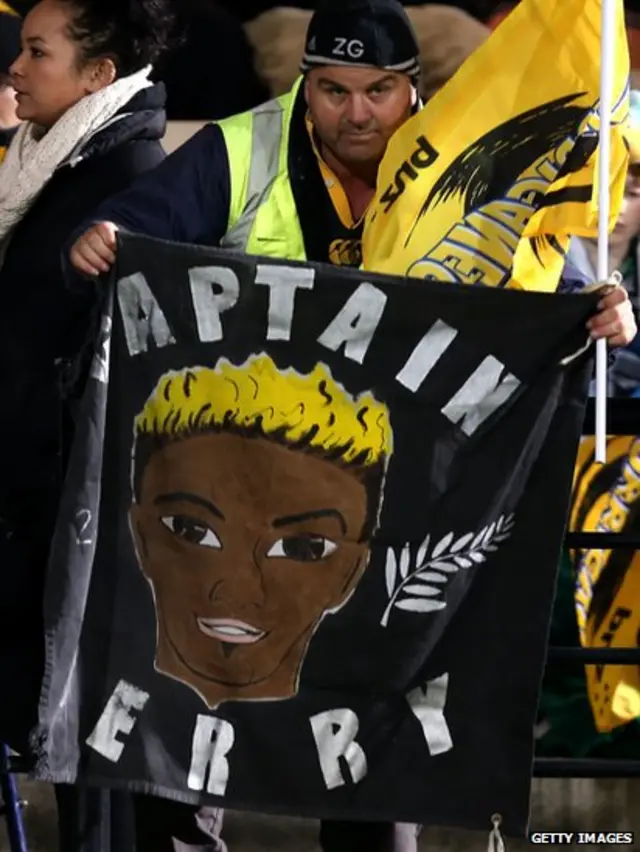 Fan holds sign praising Jerry Collins