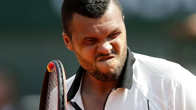 Tsonga reacts after losing a point