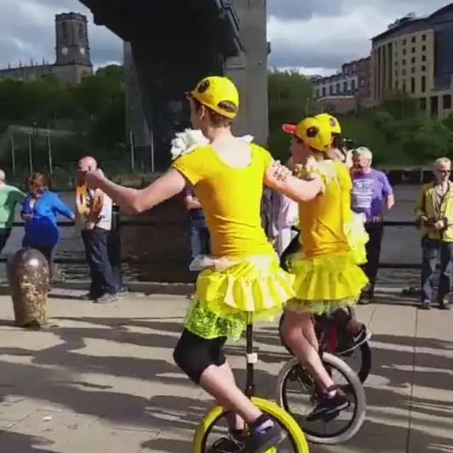 Unicyclists on Newcastle's Quayside