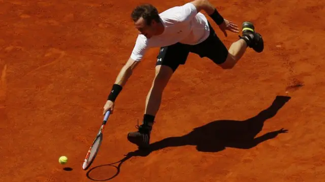 Andy Murray stretches on court