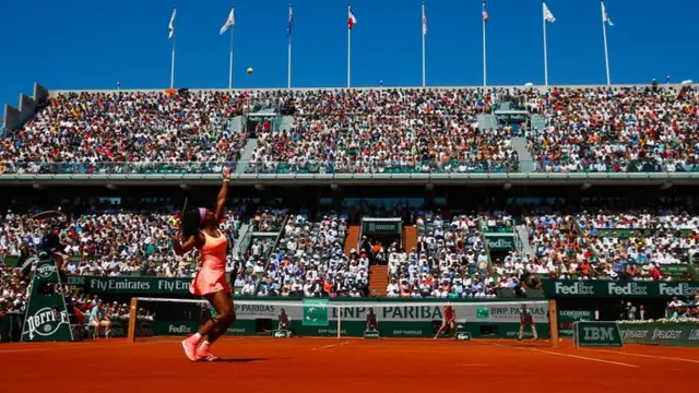 Serena Williams serves at the French Open