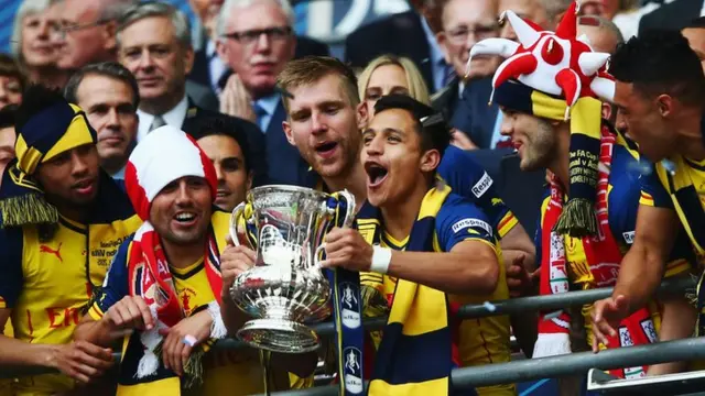 Alexis Sanchez with the FA Cup