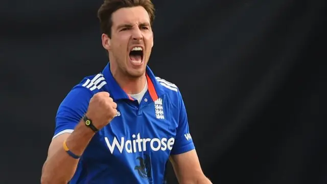 Steven Finn celebrates