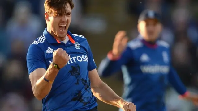 Steven Finn celebrates