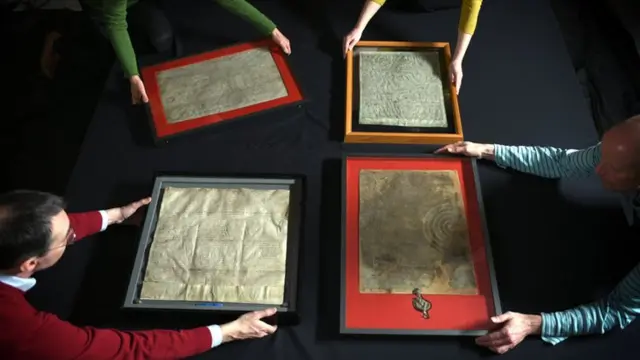 The four surviving 1215 Magna Cartas on show at the British Library