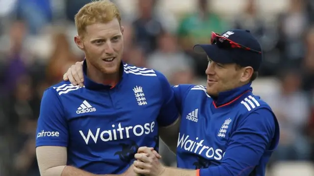 Ben Stokes (left) and Eoin Morgan (right) celebrate the wicket of Mitchell Santner