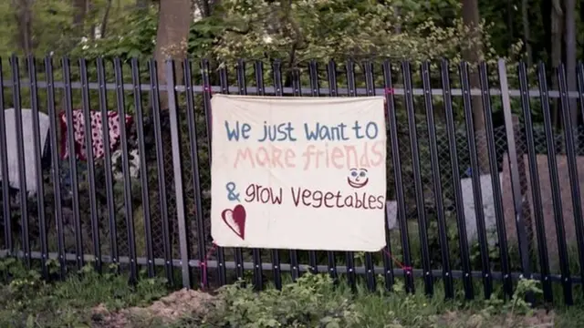 Sign on the fence that surrounds the community