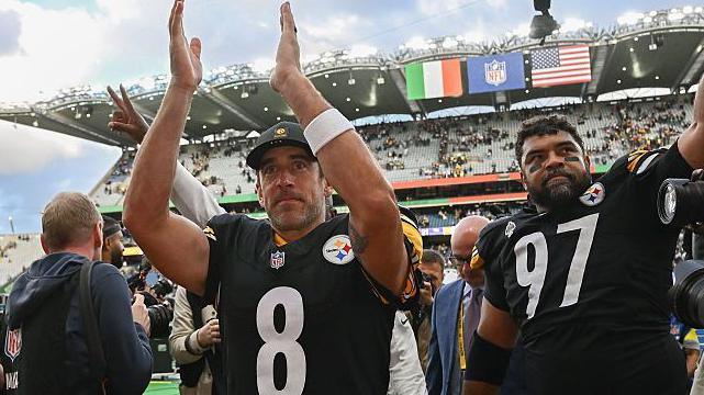 Aaron Rodgers and Cam Heyward salute the Pittsburgh Steelers fans after their win over the Minnesota Vikings in Dublin 