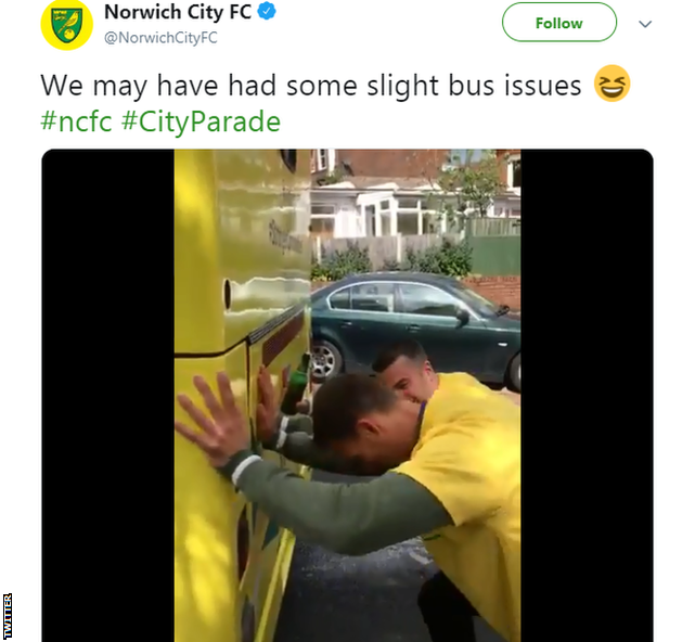 Norwich players push parade bus