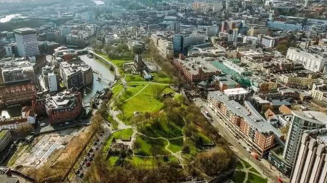 An aerial view of the city of Bristol, with a large park in the foreground 