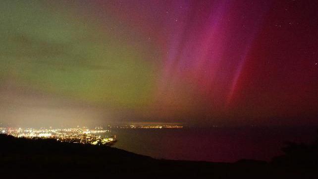 Pink and green pockets of light over Eastbourne