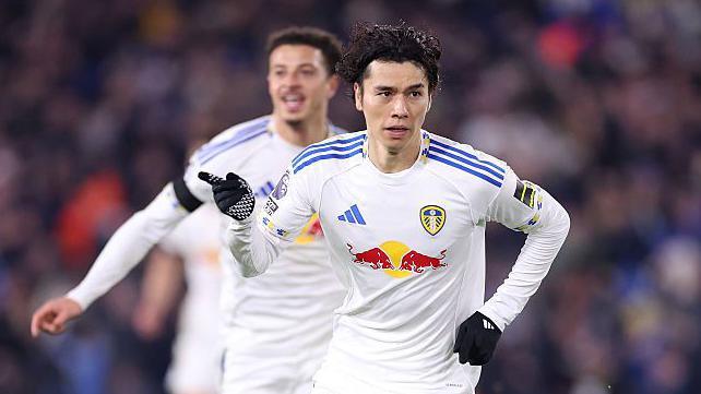 Ao Tanaka celebrates his goal for Leeds against Chelsea by waving his finger