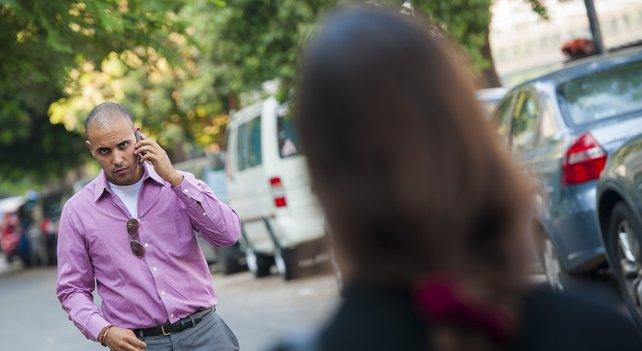 A girl walking down a street in Cairo